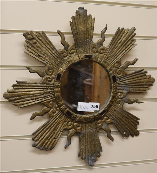 A lead starburst wall mirror, W.49cm